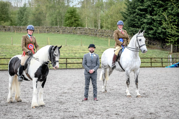 blakc-and-white cob and grey riding cob, prizewinners with the show judge